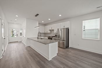 Open concept kitchen with island or bar